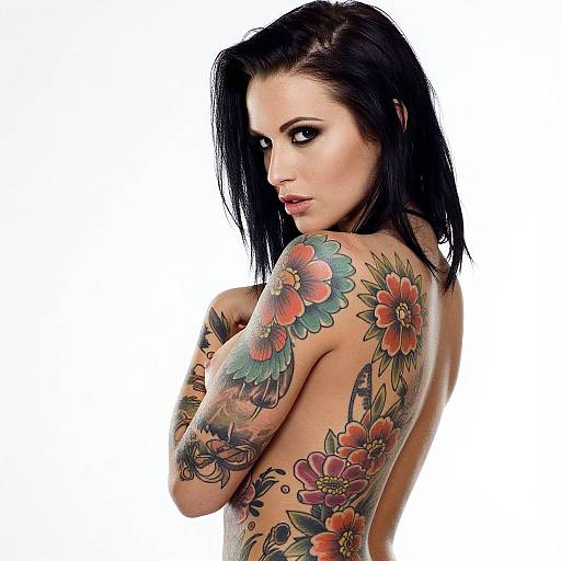 Tattooed Woman with Floral Body Art and Dark Hair