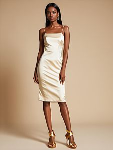 Elegant Woman in Ivory Satin Slip Dress with Gold Heels