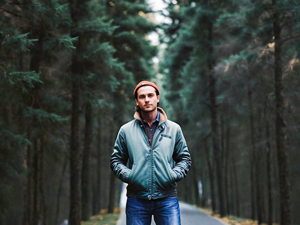 Confident Young Man in Forest Pathway