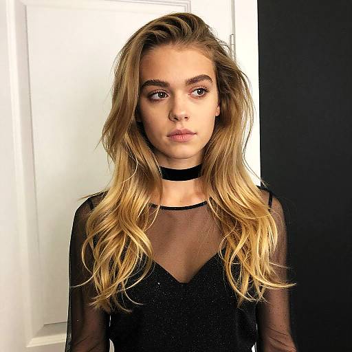 Young Woman in Sheer Black Top and Choker with Blonde Hair