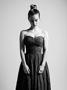Elegant Woman in Strapless Dress Black and White Portrait