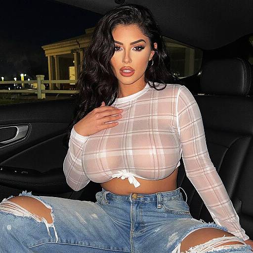 Glamorous Woman in Sheer Plaid Crop Top and Ripped Jeans Sitting in Car