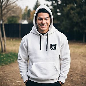 Young Man in White Hoodie Smiling Outdoors