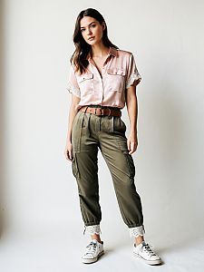 Modern Casual Outfit: Pink Satin Blouse with Olive Cargo Pants and Sneakers