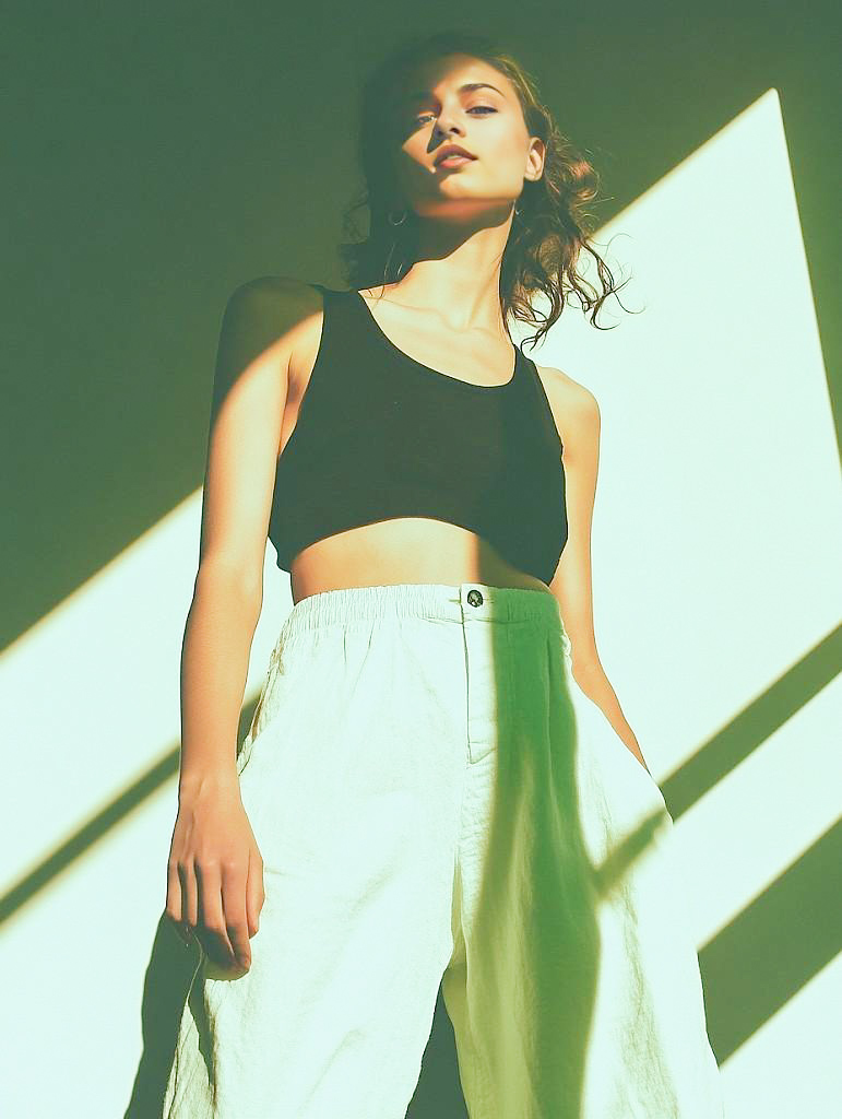 Confident Woman in Stylish Outfit with Dramatic Shadows