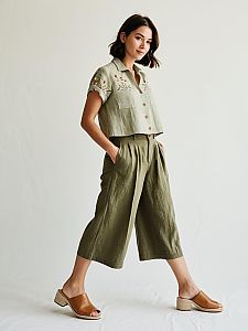 Stylish Woman in Olive Green Cropped Pants and Embroidered Shirt Walking in Casual Outfit