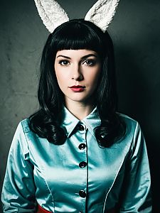 Gabi Braun Cosplay Woman in Shiny Blue Outfit with Bunny Ears