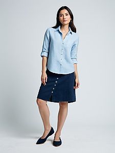 Woman Modeling Casual Light Blue Shirt and Navy Buttoned Skirt Outfit