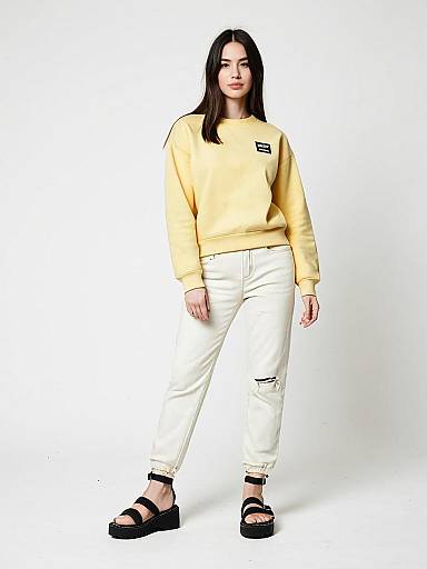 Woman in Pale Yellow Crew Neck Sweatshirt and Casual Contemporary Outfit