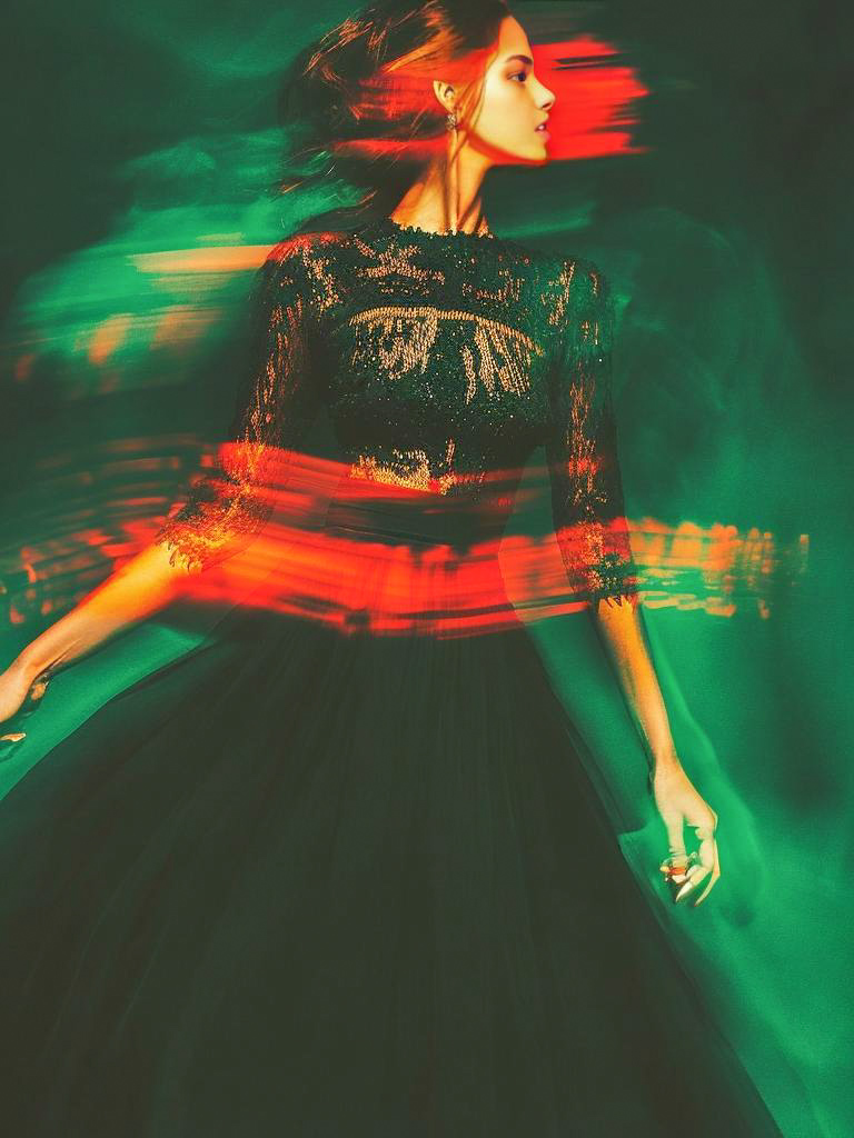 Woman in Black Gown with Green and Red Background