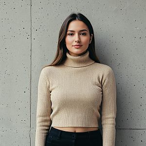 Young Woman in Beige Ribbed Turtleneck Crop Sweater Against Concrete Wall