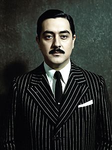 Man in Classic Gomez Addams Costume Pinstripe Suit Cosplay Portrait