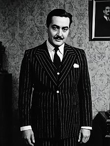 Man in Gomez Addams Costume Vintage Pinstripe Suit Black and White Portrait