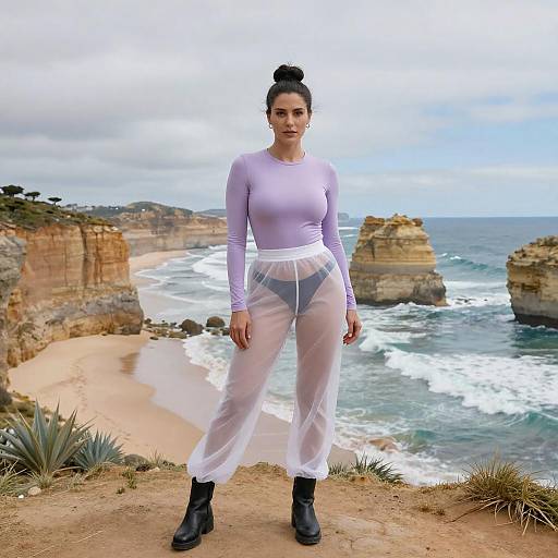 Gen Z Fashion Woman Wearing Sheer Pants and Lavender Top on Coastal Cliff