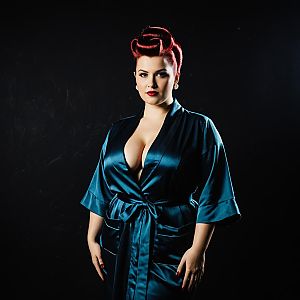 Vintage Glamour Woman in Satin Robe with Retro Hairstyle