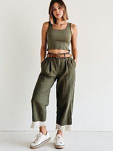 Casual Olive Green Outfit with Crop Top and Lace-Trimmed Pants on Woman