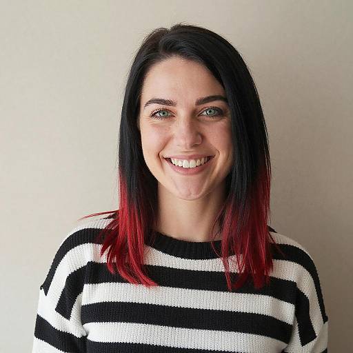 Smiling Young Woman with Red-Tipped Hair in Black and White Striped Sweater