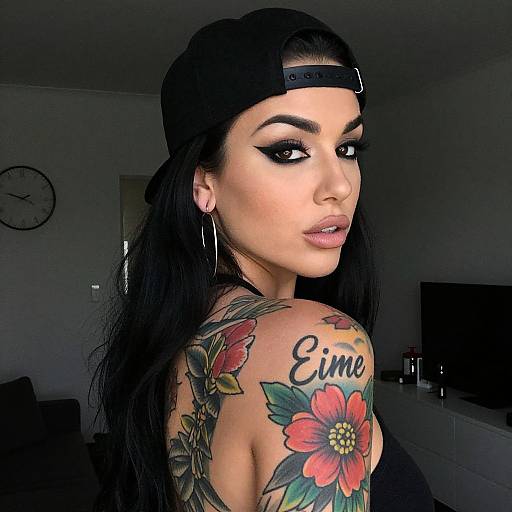Portrait of Woman with Floral Tattoo and Black Cap