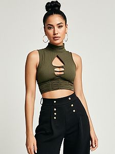 Woman in Contemporary Street Style Olive Green Crop Top and Black High Waisted Pants