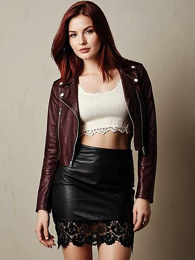 Stylish Woman in Maroon Leather Jacket and Black Lace Hem Skirt