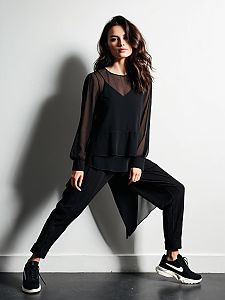 Woman Wearing Contemporary Casual Layered Black Semi-Sheer Blouse and Black Pants
