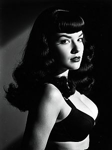 Vintage Style Woman with Bettie Page Bangs Waist-Up Editorial Portrait