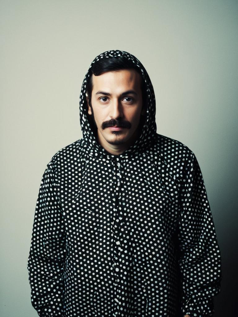 Man Wearing Black Polka Dot Hoodie in Detailed Studio Portrait