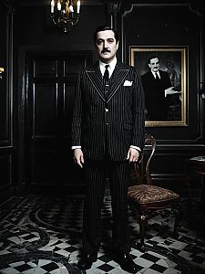 Man in Gomez Addams Classic Pinstripe Suit Costume in Gothic Mansion