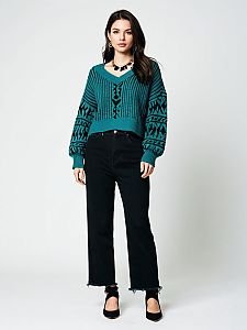 Woman in Casual Chic Oversized Teal Ribbed Knit Sweater with Black Cropped Jeans