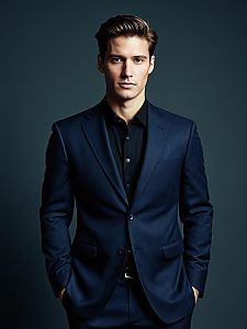 Young Man in Navy Blue Suit with Black Shirt Fashion Portrait