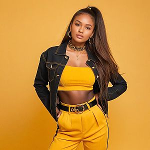 Confident Woman in Stylish Yellow Outfit