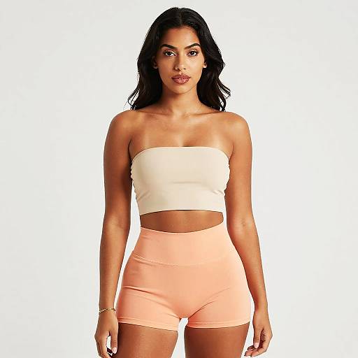Woman in Beige Strapless Top and Peach High-Waisted Shorts Studio Portrait