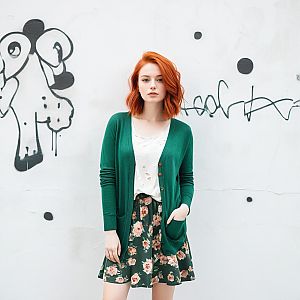 Young Woman with Red Hair in Urban Style
