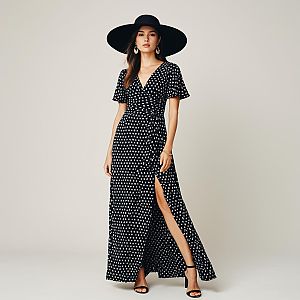 Stylish Woman in Black Polka Dot Maxi Dress