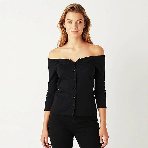 Confident Young Woman in Off-the-Shoulder Black Top and Black Pants