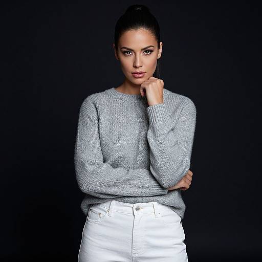 Confident Woman in Gray Knit Sweater and White Pants Studio Portrait