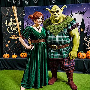 Medieval Couple in Green Costume at Halloween Event