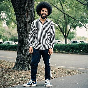 Man with Afro Outdoors in Striped Shirt