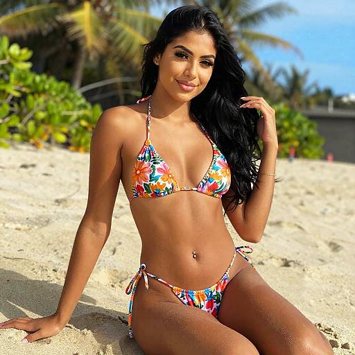 Woman in Floral Bikini Posing on Sunny Beach with Palm Trees