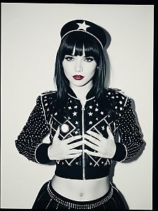 Woman in Star-Adorned Pop Star Costume Waist-Up Editorial Portrait