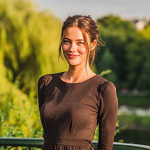 Young Woman in Brown Dress at Park