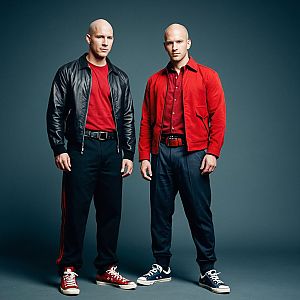 Two Bald Men in Stylish Red and Black Outfits