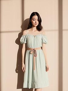 Bohemian Chic Woman in Pale Mint Green Off-the-Shoulder Midi Dress