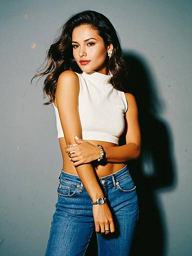 Woman Wearing Casual Chic White Cropped High Neck Sleeveless Tank Top and Blue Jeans