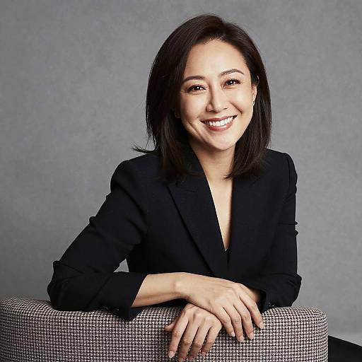 Confident Woman in Black Blazer Smiling Professional Portrait
