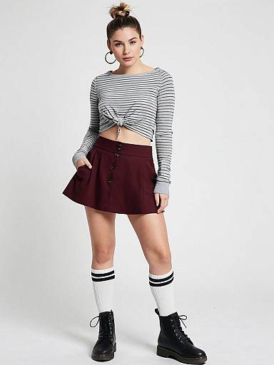 Woman Wearing Casual Sporty Cropped Long Sleeve Top in Light Gray with Burgundy Mini Skirt