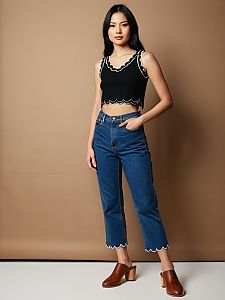 Casual Chic Woman in Cropped Black Scalloped Tank Top and High-Waisted Jeans