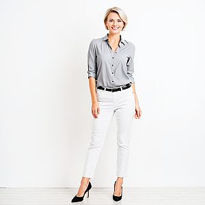 Confident Woman in Stylish Gray Shirt and White Pants