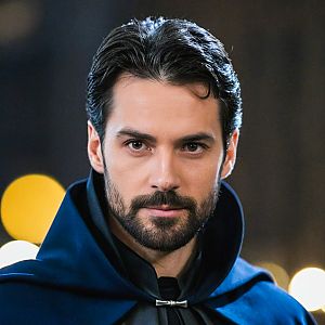 Close-up Portrait of a Man in Dark Cloak