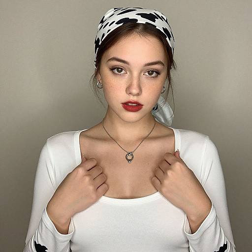 Portrait of Young Woman Wearing White Top and Patterned Headscarf